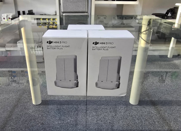 New DJI Mini 3 Pro Intelligent Flight Batteries plus packaging displayed on a table.