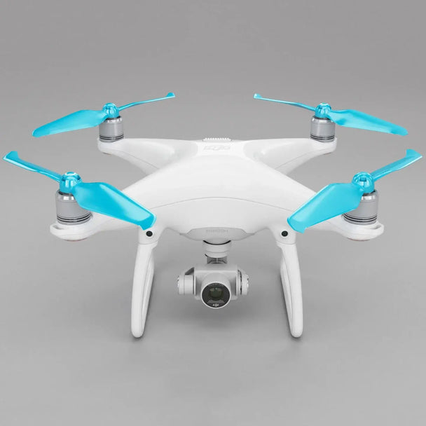 DJI Phantom 4 drone featuring blue STEALTH propellers for improved flight time and low-noise operation.