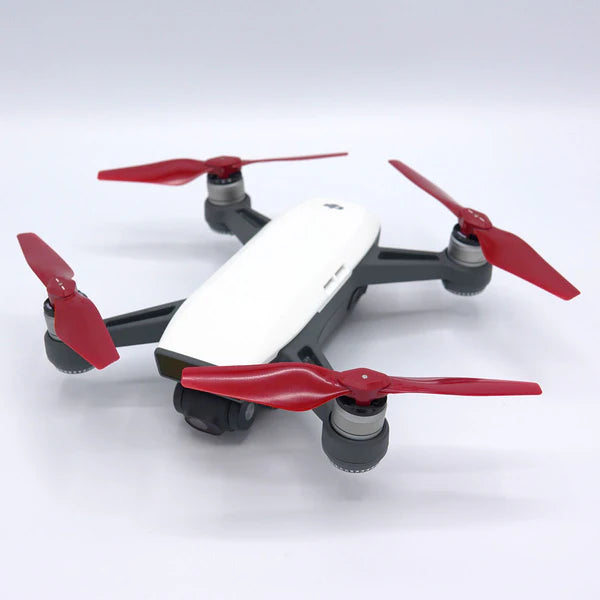 DJI Spark drone with red STEALTH upgrade propellers, showcasing low-noise, high-performance design for enhanced flights.